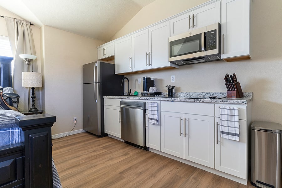 Full size Refrigerator, Sink, Dishwasher, Microwave and Cooktop