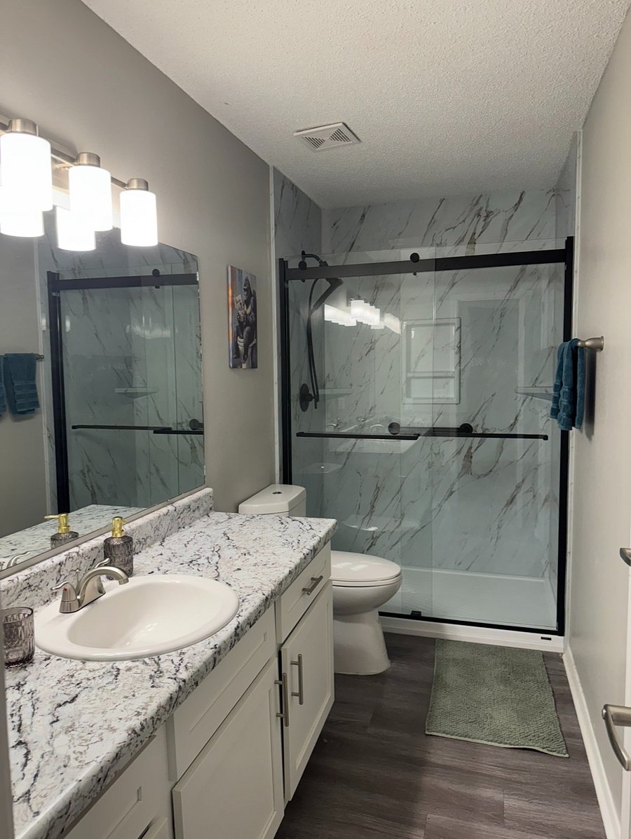 Largest bathroom newly renovated with walk in shower and quality fixtures + grab bars
