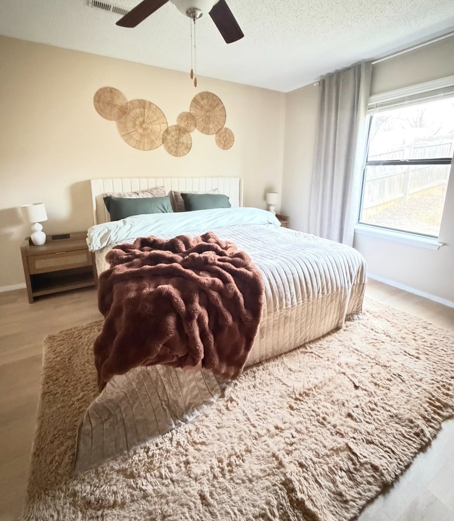 Master bedroom w/King size bed and calming surroundings. Nightstands w charging stations and window to private backyard.
