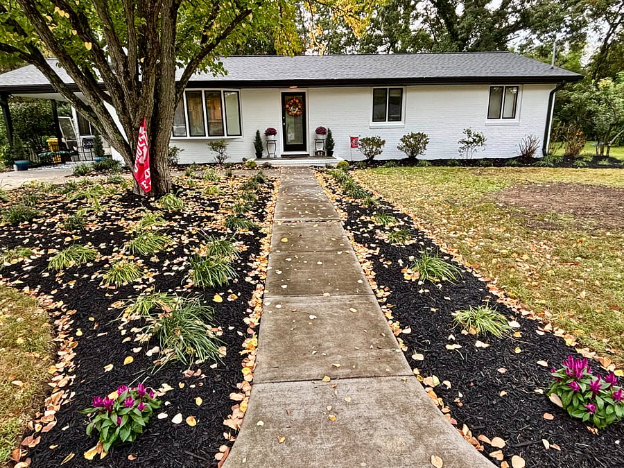 Autumn front view. Unit entrance is on far right side of house. Yard will have full plants and flowers in spring and summer.