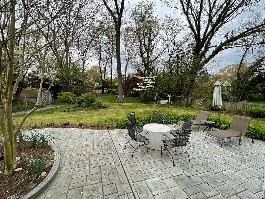 View from bathroom and bedroom window. Spring and summer time yard is full or flowers