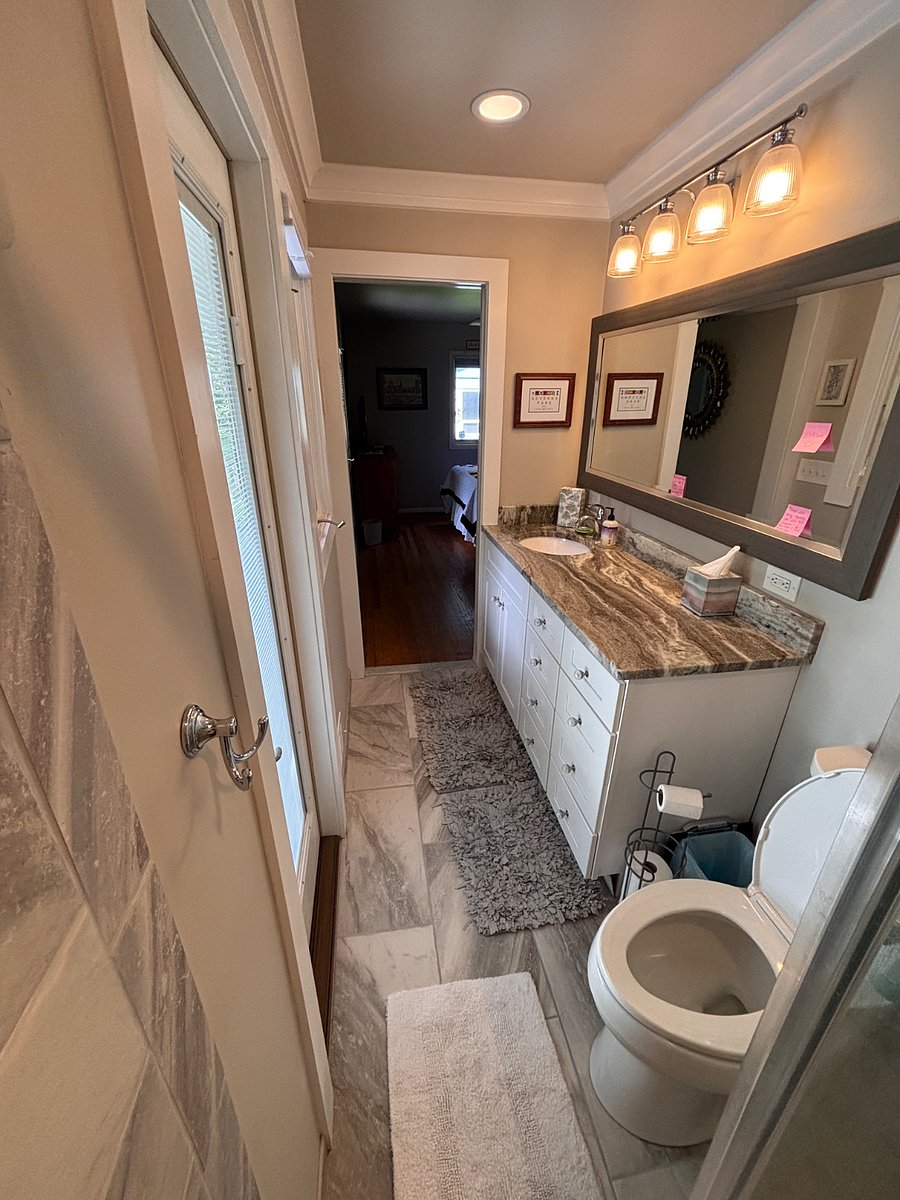 This photo shows the pocket door entrance to the bedroom