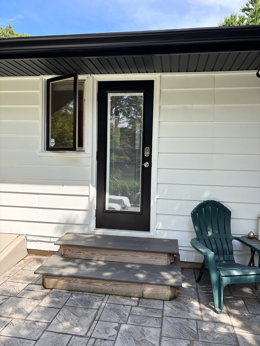 This photo shows the private dedicated keypad entrance to the unit entering into the master bath up to exterior stairs so occupant must have physical capability and stability in all weather conditions.