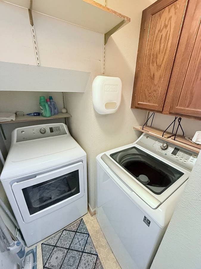 small laundry room, just off the kitchen- working washer & dryer