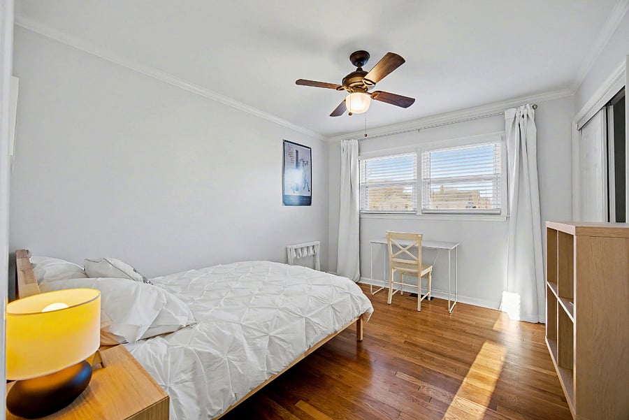 Bedroom #1 with full size bed, designated work space & custom built closet