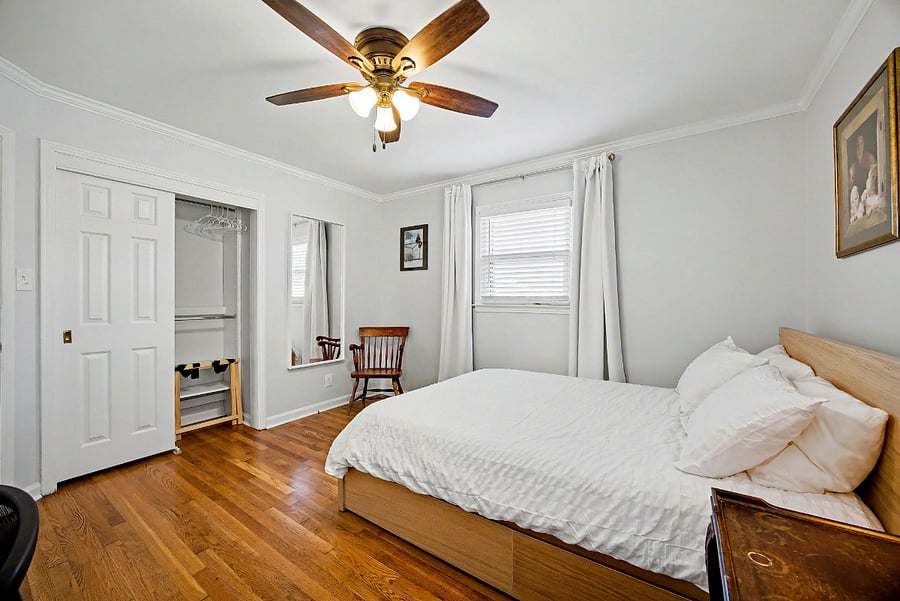 Bedroom #2 with queen size bed, designated work space & custom built closet