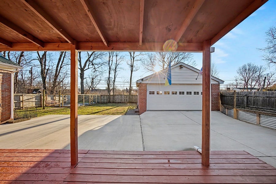 Fenced-in backyard with covered back deck & patio