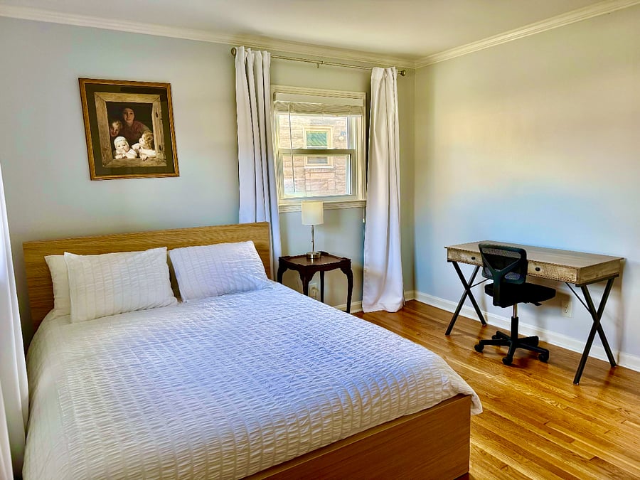 Bedroom #2 with queen size bed, designated work space & custom built closet