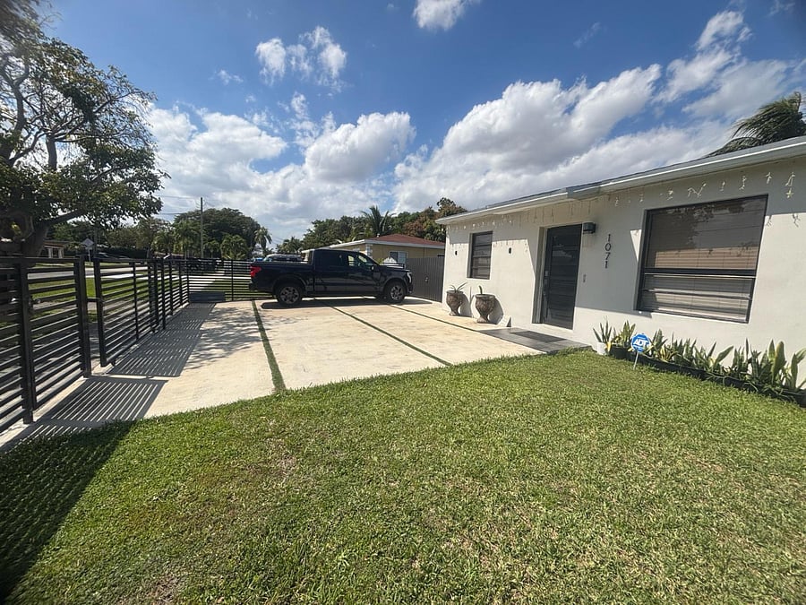 Two (2) parking spots on the inter gate/fence and five (5) in front of the house.