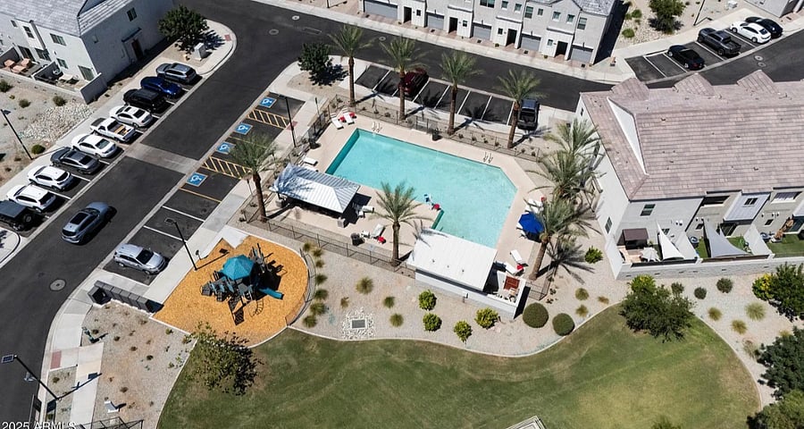 Community Aerial View-Amenities: uncovered/unassigned parking, pool, playground, mailboxes. This area is about 50 feet from my home. 