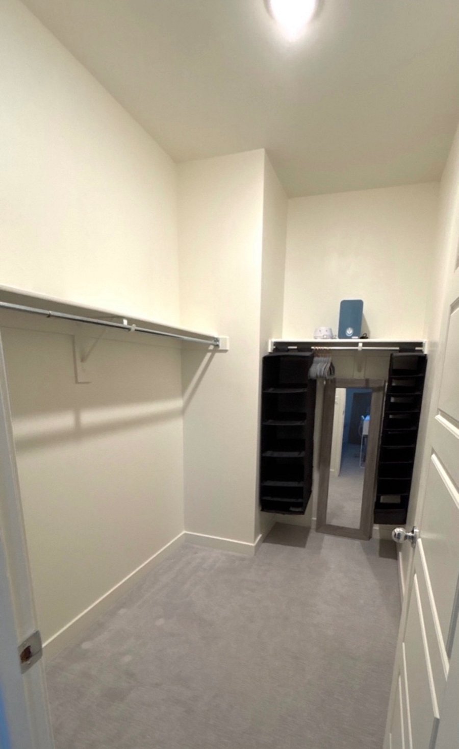 Large walk-in closet, plenty of storage space, mirror, air, purifier, and sound machine. 