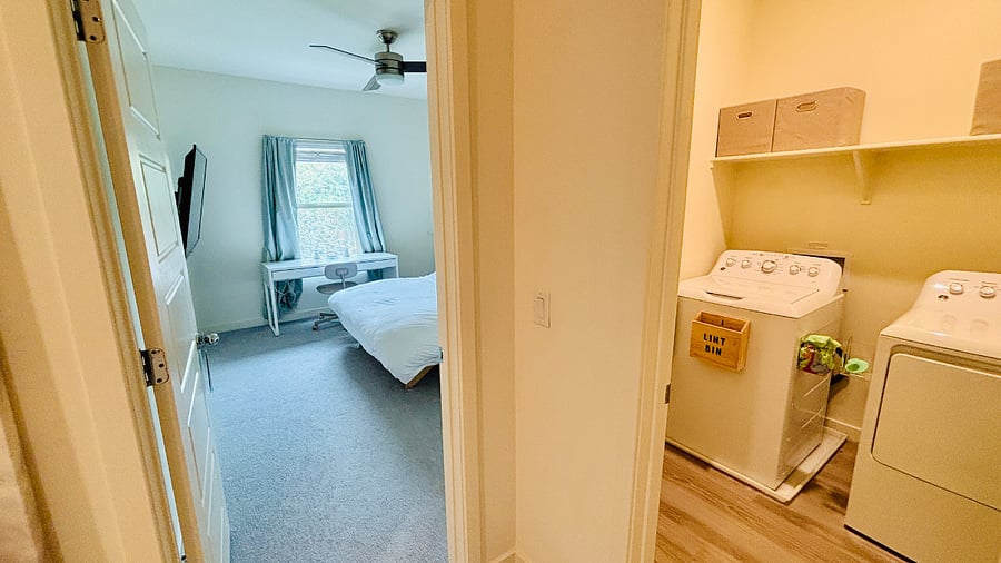 Guest suite next to walk-in laundry room (door is open for viewing purposes)

