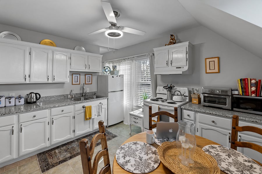 Kitchen has full fridge, stove/over, coffee maker, air fryer, blender. Appliances are Whirlpool and Cuisinart. 
Note: the kitchen does not have a dishwasher. 