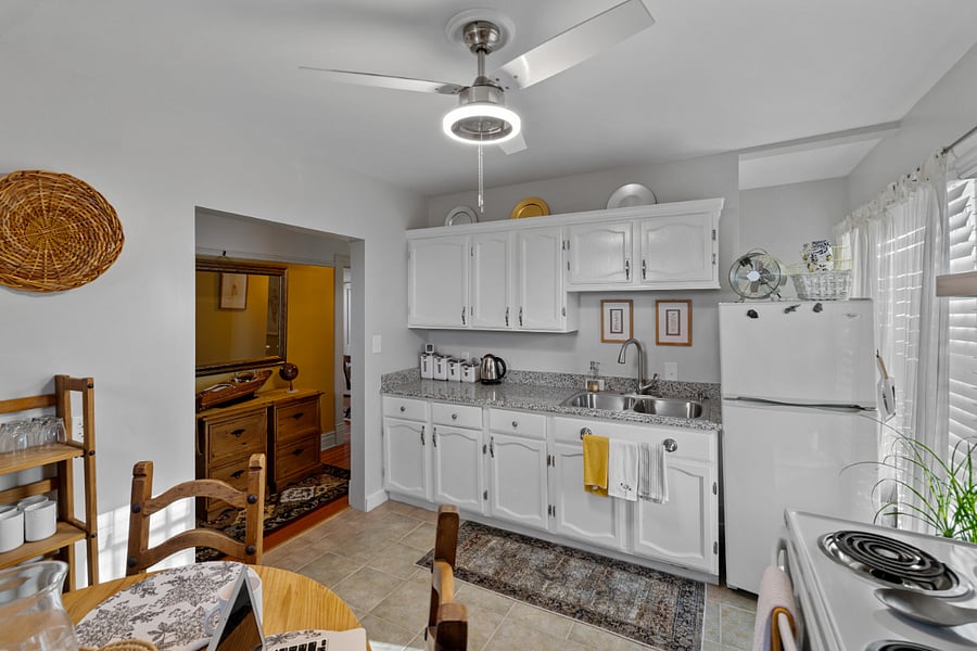 Kitchen has full fridge, stove/over, coffee maker, air fryer, blender. Appliances are Whirlpool and Cuisinart. 
Note: the kitchen does not have a dishwasher. 