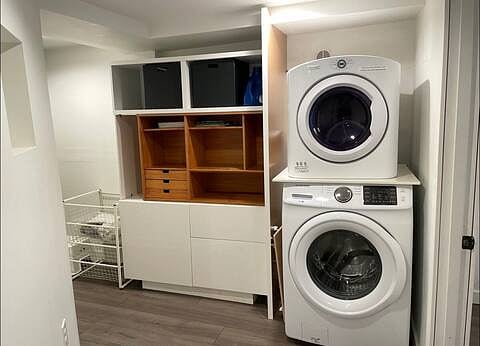 Hallway and laundry area with lots of storage.