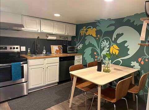 Kitchen and dining room with large table and 4 chairs