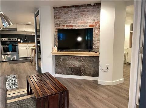 Living area with 42" smart tv, coffee table and comfy couch