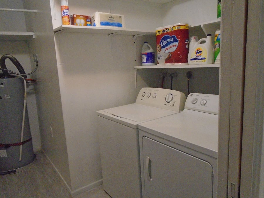 Washer, dryer, large utility room, new ironing board