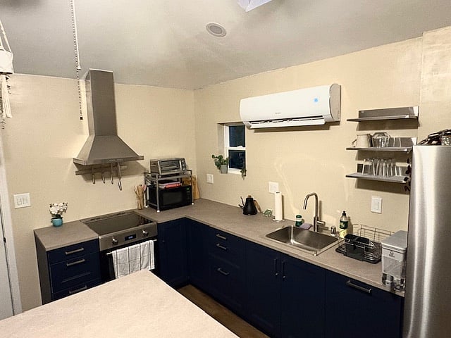 Brand new kitchen with externally vented hood