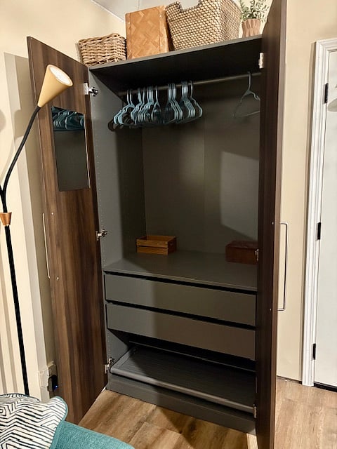 Armoire with hangers, drawers, shoe storage