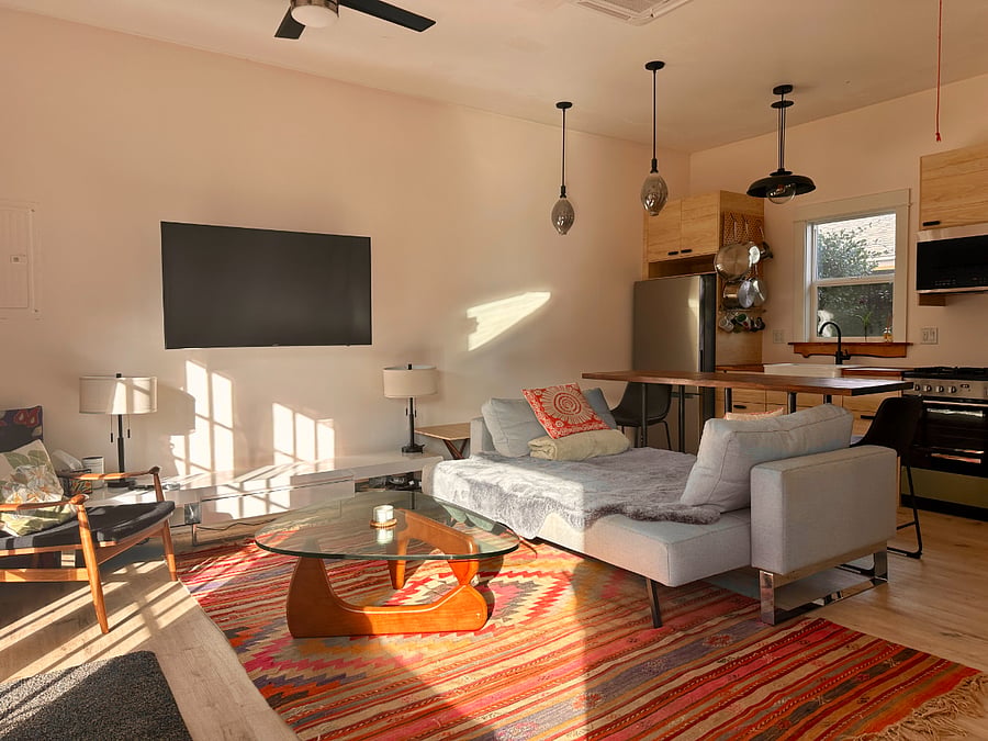 Cozy open concept living room and kitchen work area.