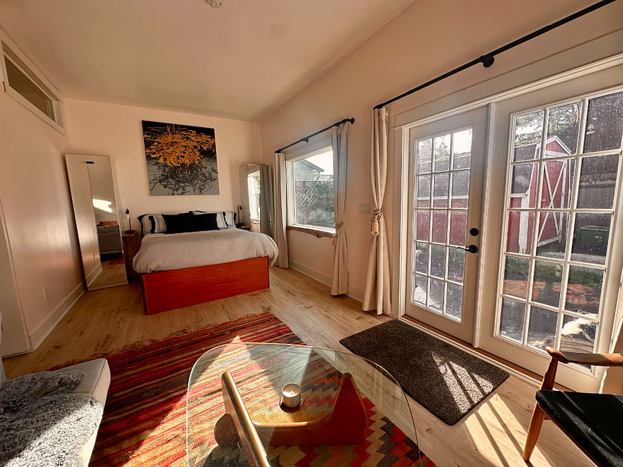 Ample light floods in from the picture window and French Doors.