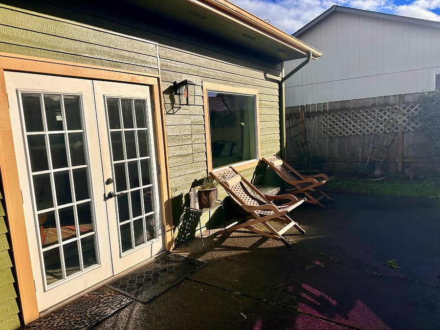 Enter Bungalow through French Doors.  When it is sunny sit in front of the picture window.  Black light blocking shades cover windows for blackout effect.