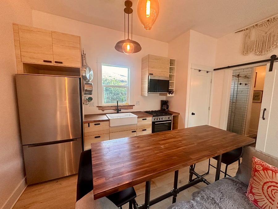 New Kitchen with gas stove, oven, microwave, sink disposal and new fridge. Kitchen comes stocked with all cooking amenities.