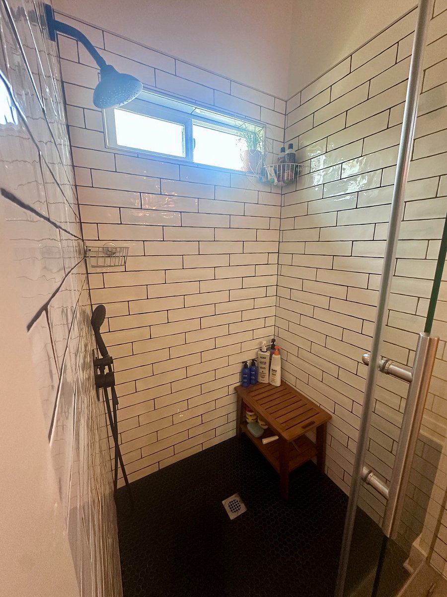 Huge shower, on demand hot water heater.  Never run out of hot water.  Rainshower head with excellent strong water pressure.  Little shower bench you can relax on to use the handheld shower head.