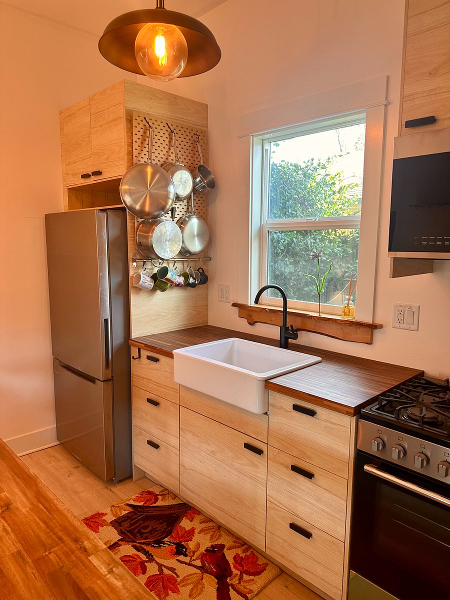 Butcher block counters in kitchen. Kitchen comes stocked with all necessary kitchen amenities, cooking supplies, coffee maker and cleaning supplies.