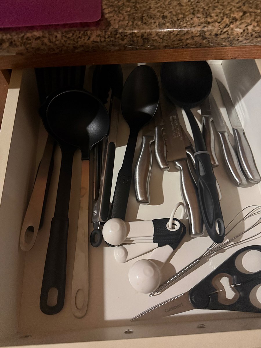 Another drawer with cooking utensils. 