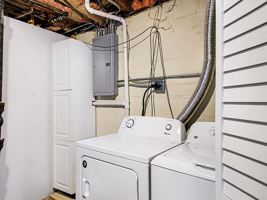 Laundry room is just outside of the bathroom with a washer and dryer for your convenient.