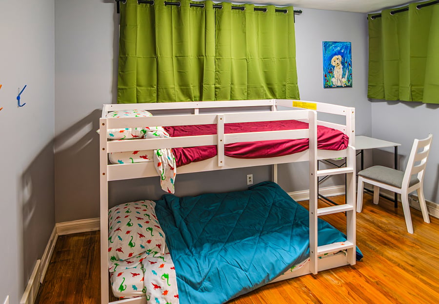 Our twin bunk features quality 8 and 6 inch mattresses. Perfect for kids or solo sleepers. Room also features blackout curtains for complete privacy & darkness when desired.