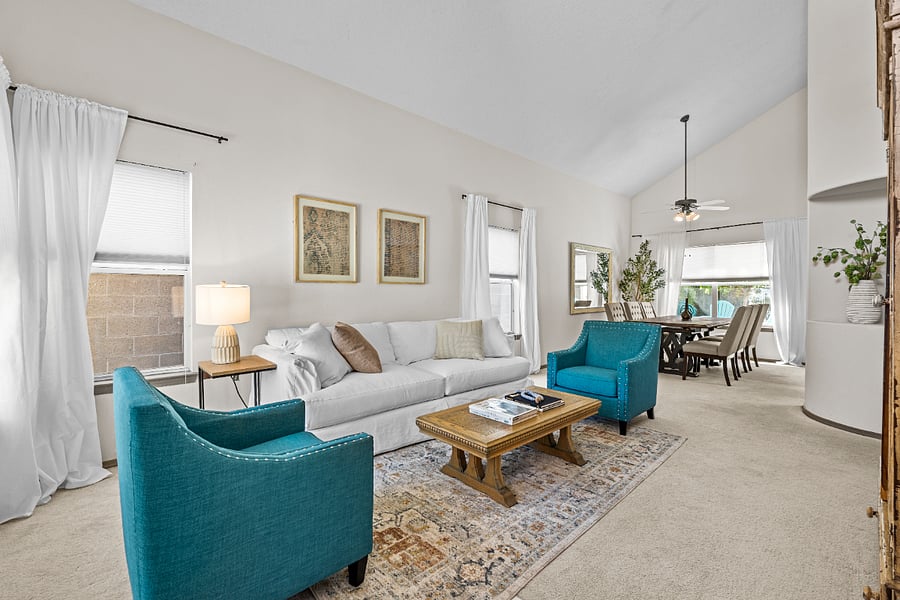 step into a beautiful light filled room as soon as you walk in- with high ceilings and ample natural light- this cozy living room includes a designer queen sleeper sofa and sitting area with smart tv and large dining area