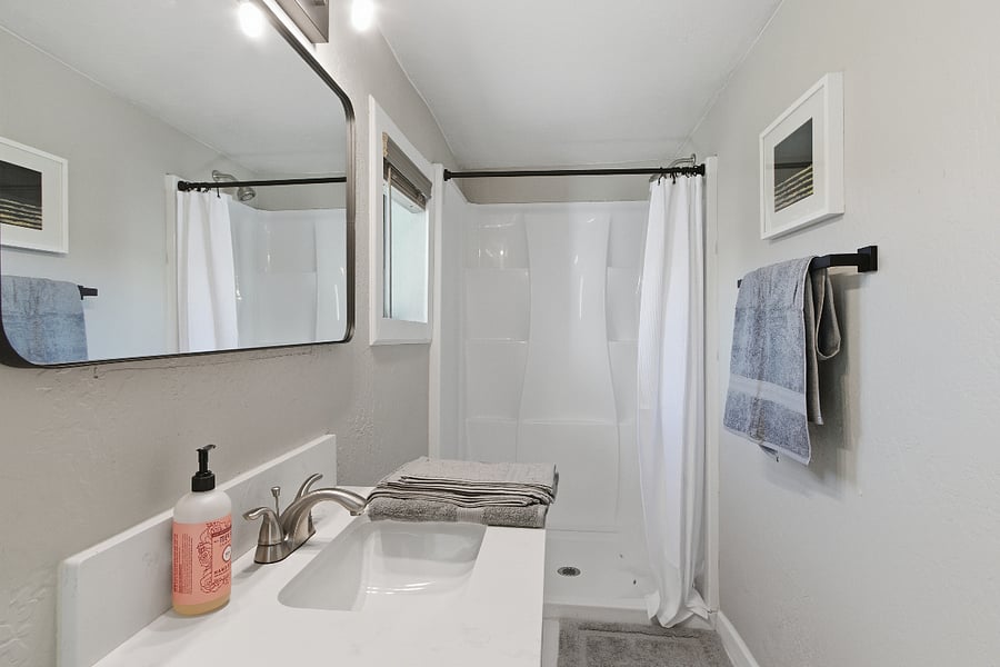 Bathroom #1 Newly upgraded shower, mirrors and lights. Brand new bath linens provided.