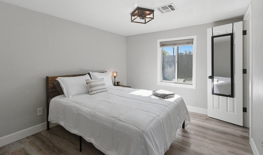 Bedroom #3 Queen size bed, full length mirror, upgraded lights and plenty of natural light.