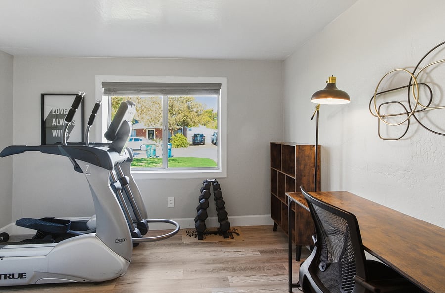 Gym and Home Office.  This was a 4th bedroom we converted to a workout space and home office. Large new elliptical trainer and weights. Brand new desk and chair.