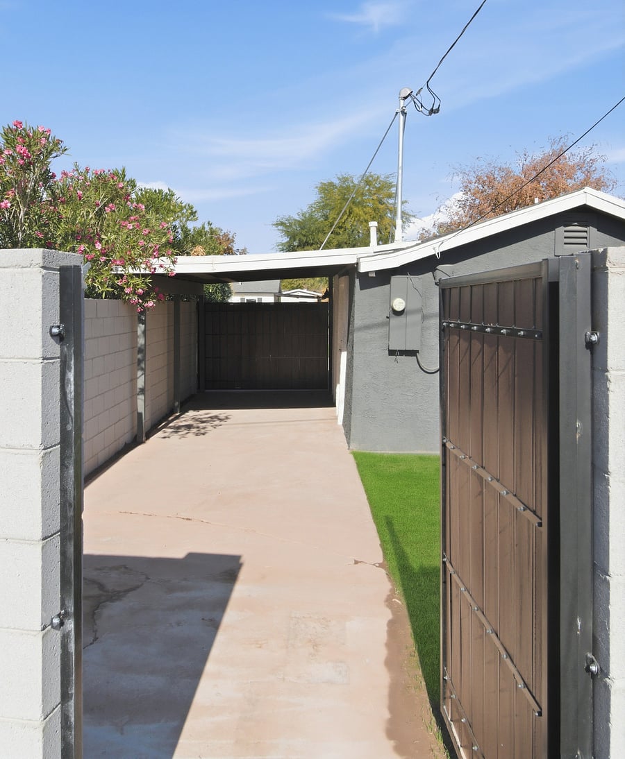 Direct entrance to the canal from backyard and a view of the carport.