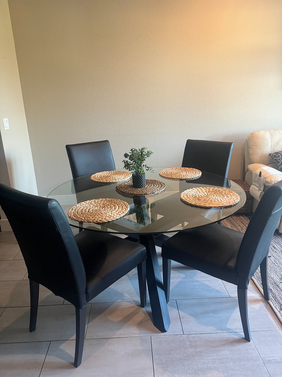 Dining table seats 4, with additional seating at the island.