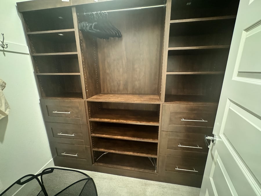 A comfortable walk in closet in the primary suite.