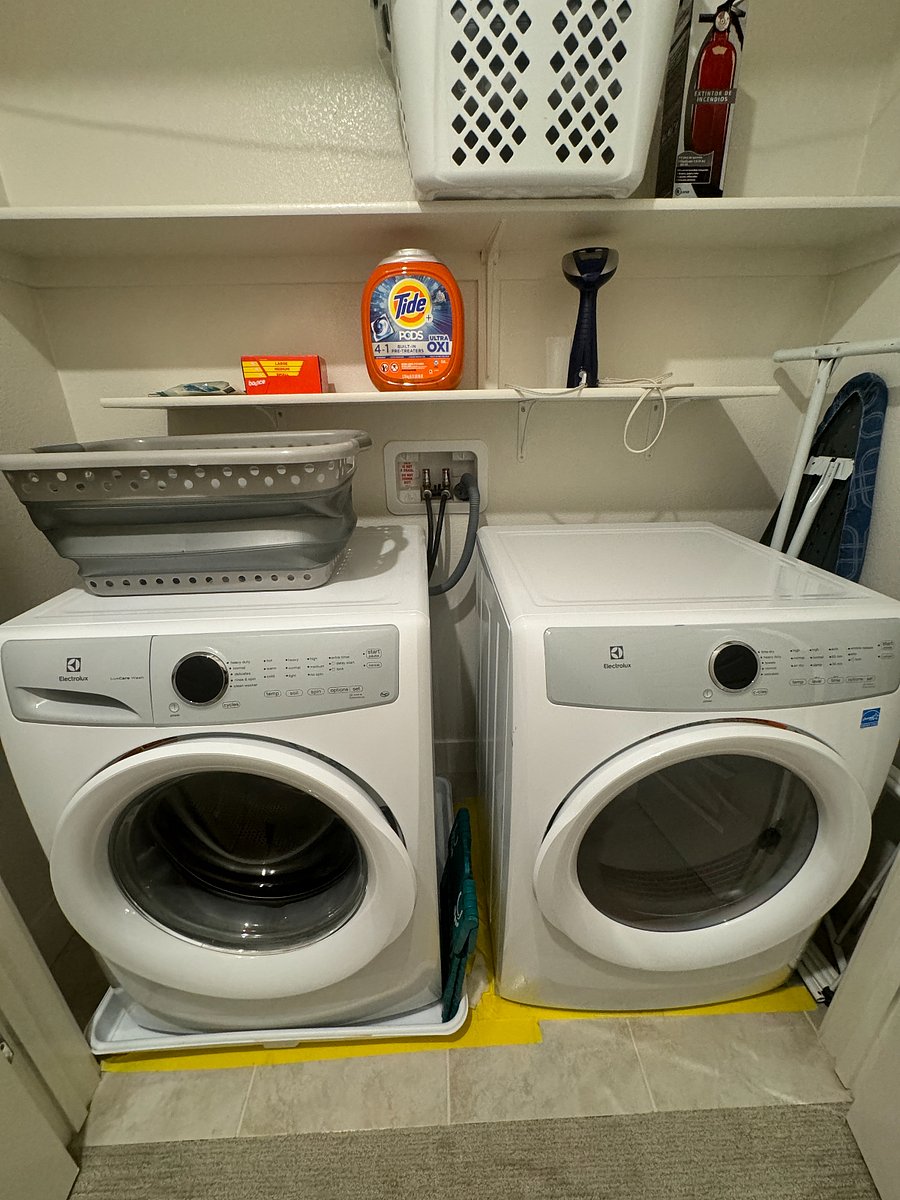 Full size washing machine and dryer closet on the third floor.
