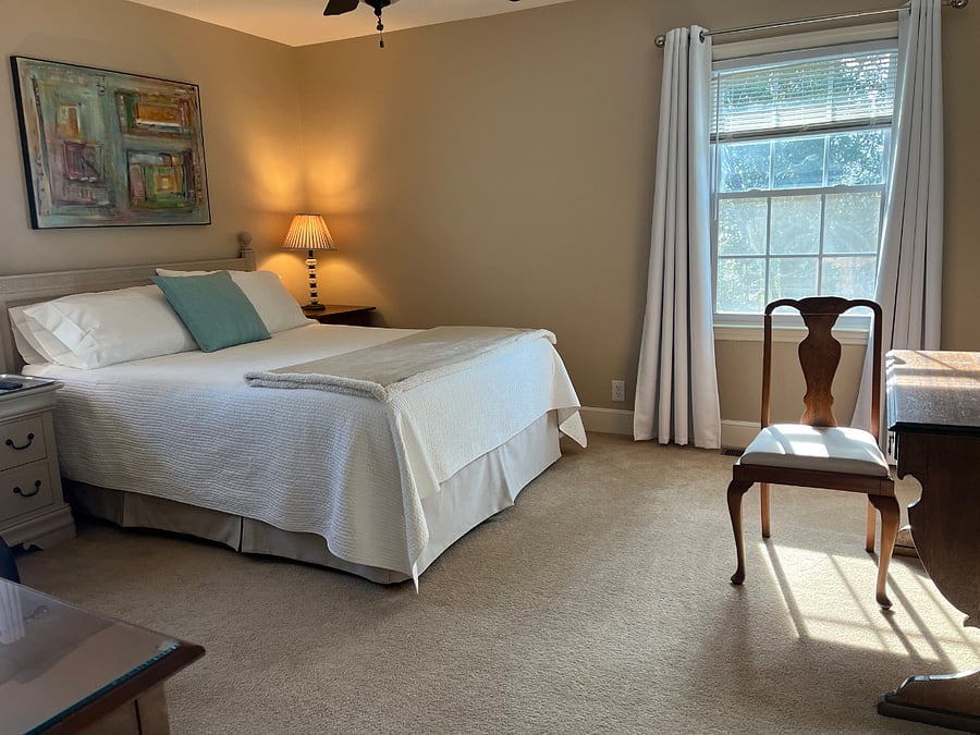 Master bedroom is large with 2 closets and recliner and TV