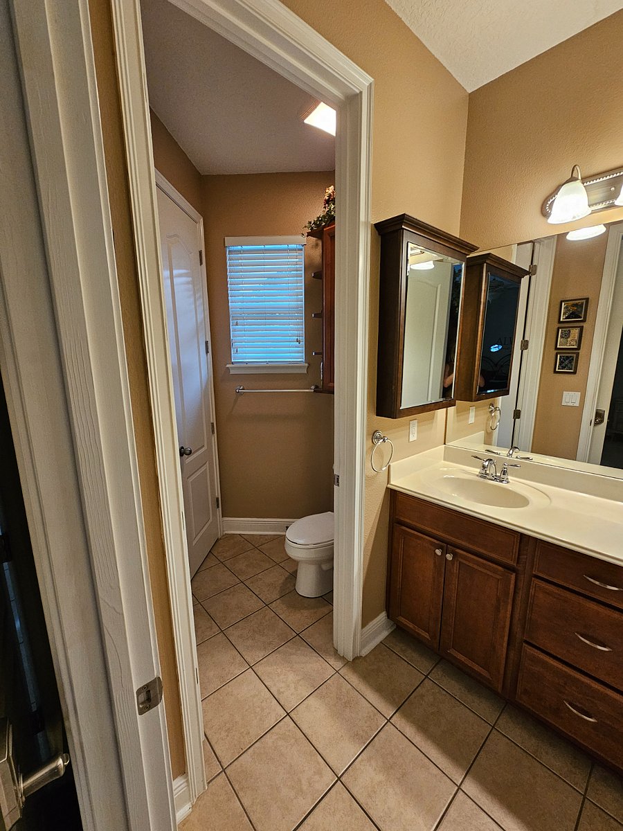 Downstairs Master Bathroom with dual vanity and plenty of storage