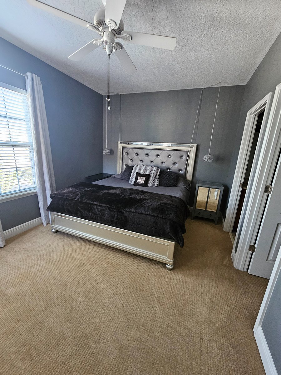 Upstairs King bedroom with private bath, walk in closet, room darkening curtains and balcony