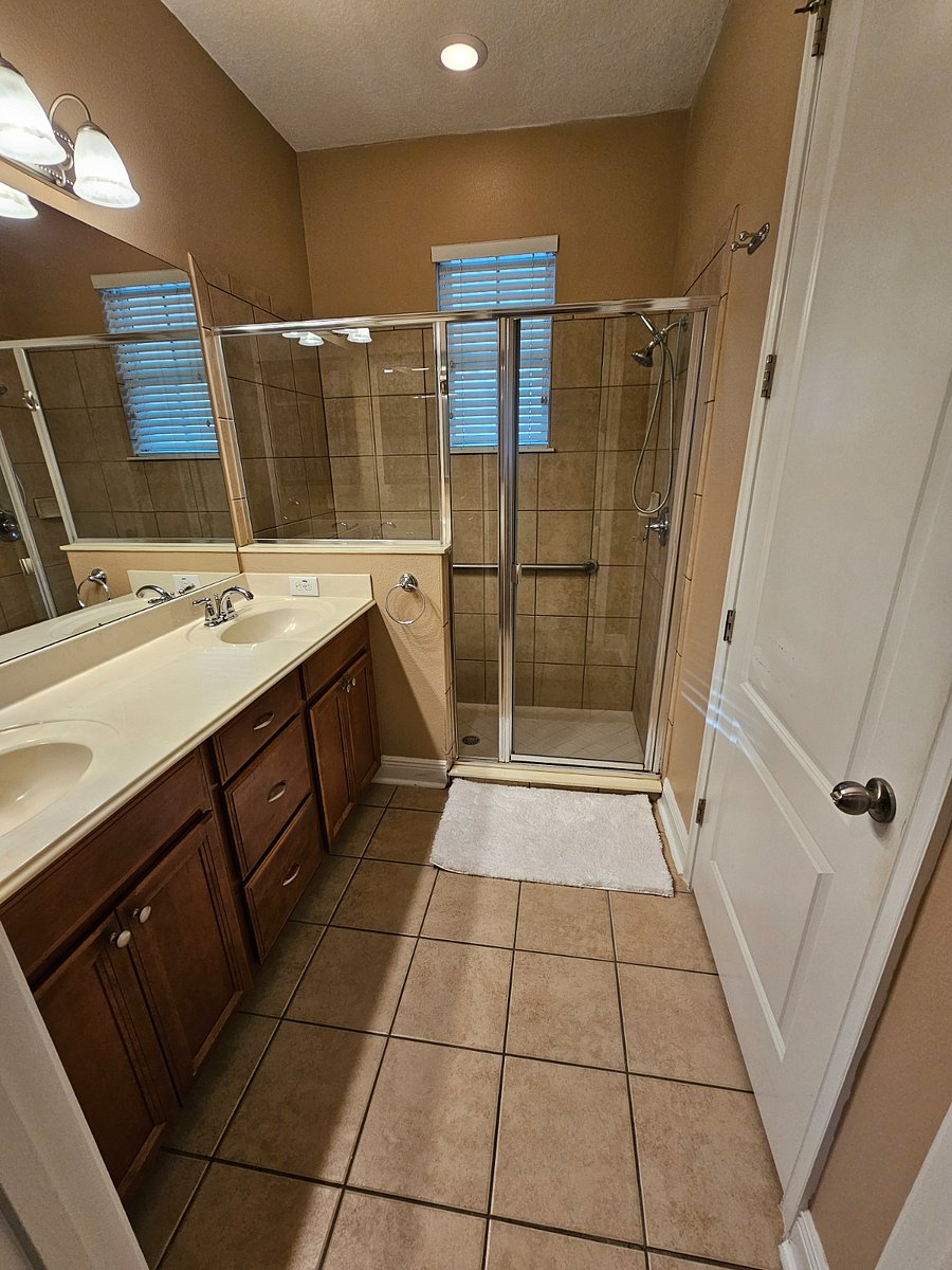 Downstairs master bathroom with dual vanity and plenty of storage