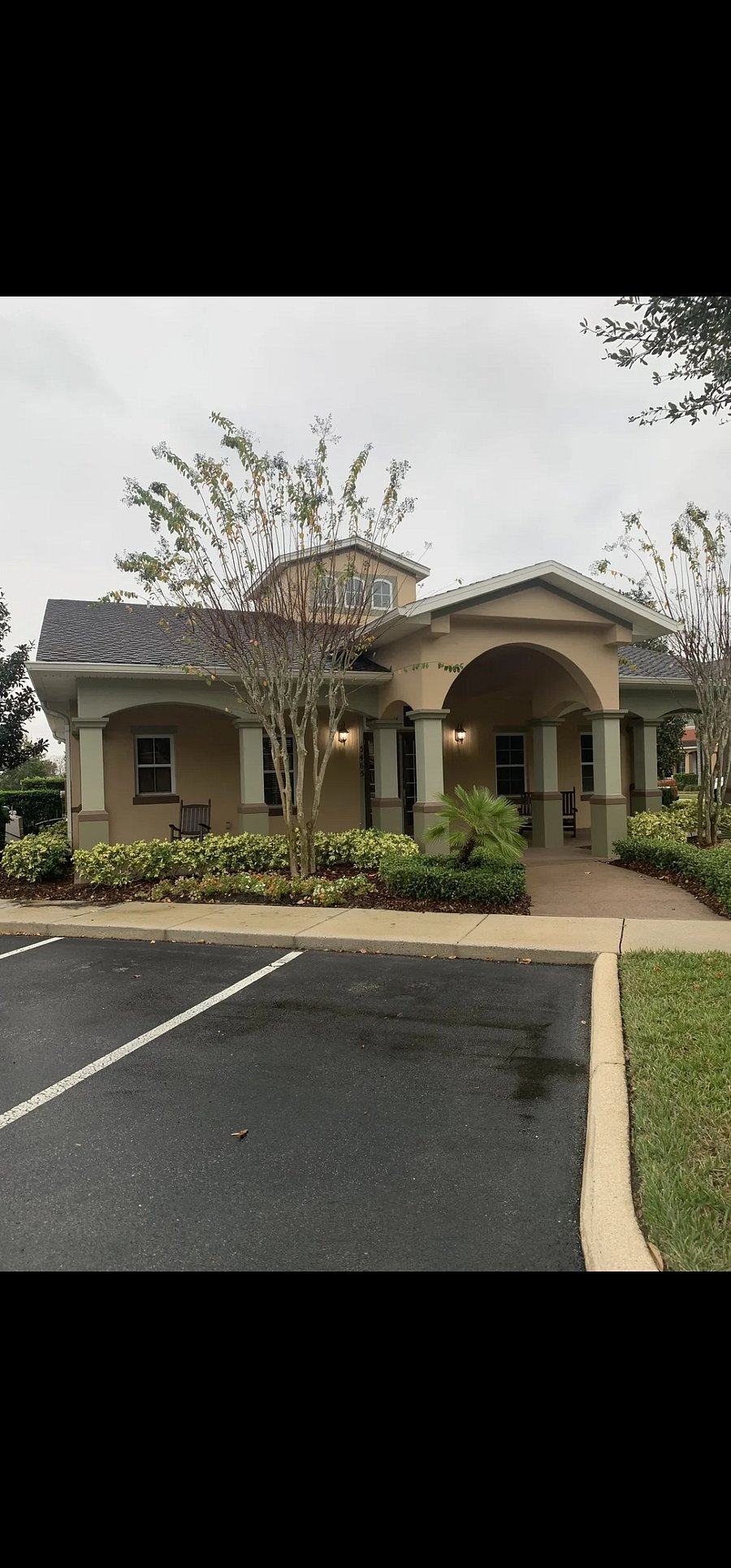 Clubhouse next to mailboxes and attached to the pool
