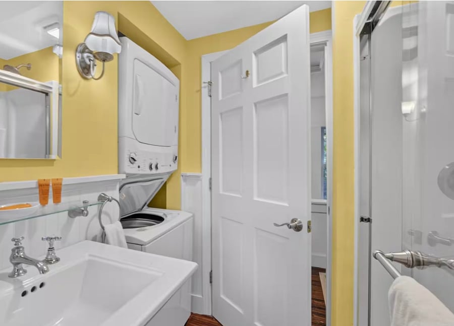 Second bathroom upstairs with washer and dryer