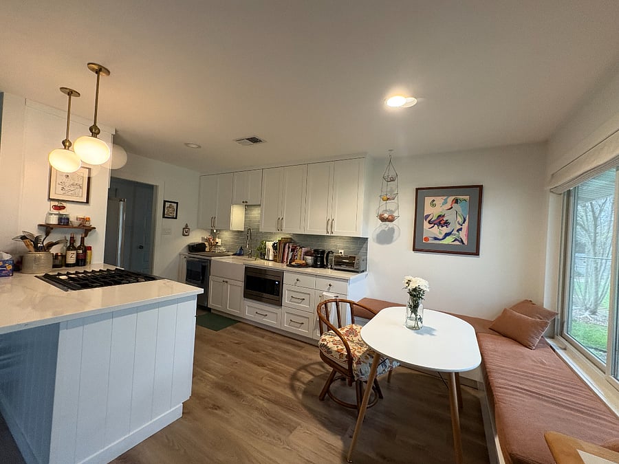 The common kitchen area with microwave, stovetop, oven, coffeemaker, refrigerator and featuring the breakfast nook!