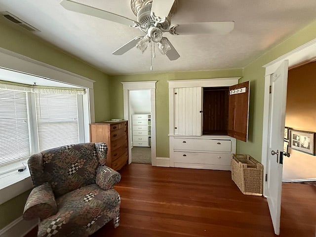 Upstairs bedroom with walk in closet and built in armoire