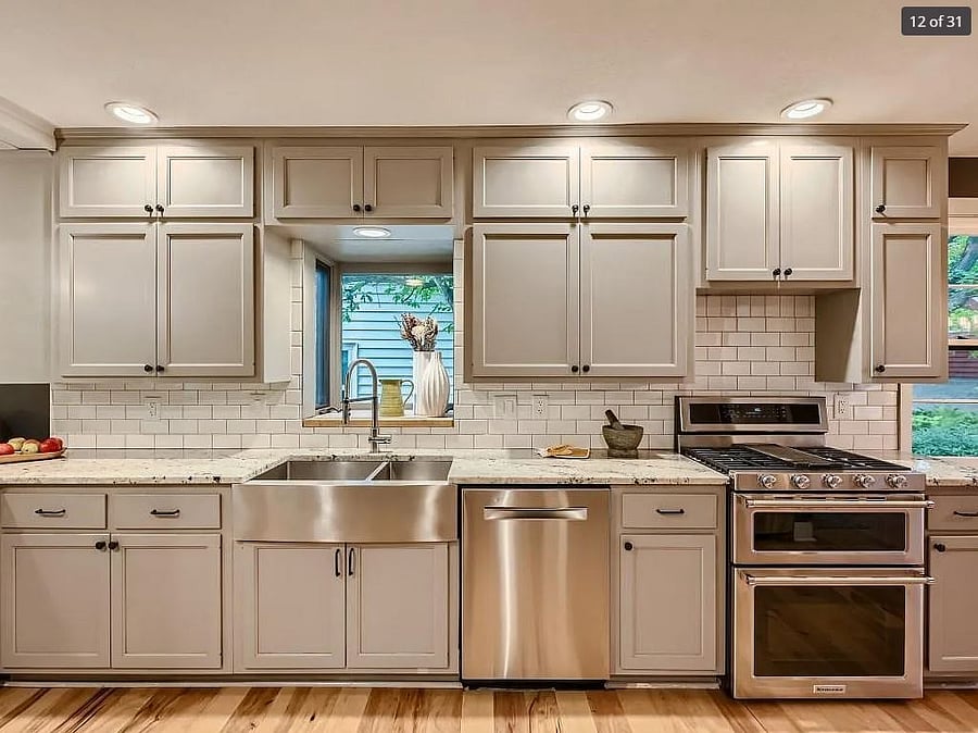 Large, modern kitchen with upgraded appliances and plenty of room for hosting.